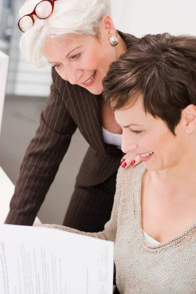 Two Women Studying Some Papers — Stock Photo, Image