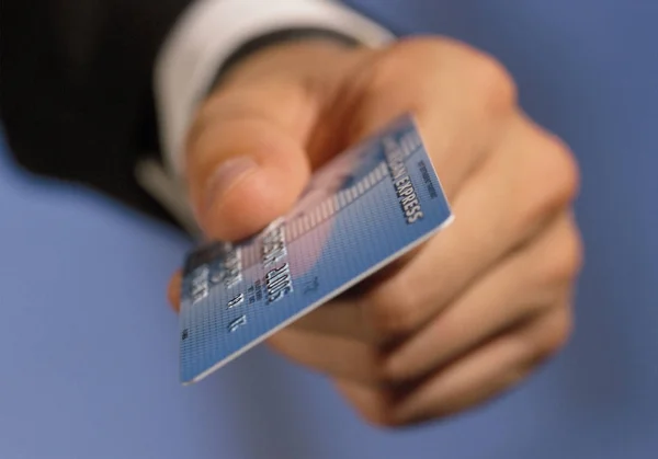 Cropped Image Man Holding Credit Card Blue Blurred Background — Stock Photo, Image