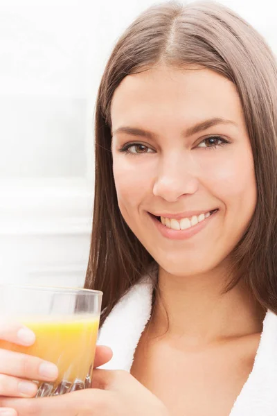 Smiling Young Attractive Caucasian Woman Drinking Orange Juice Royalty Free Stock Photos