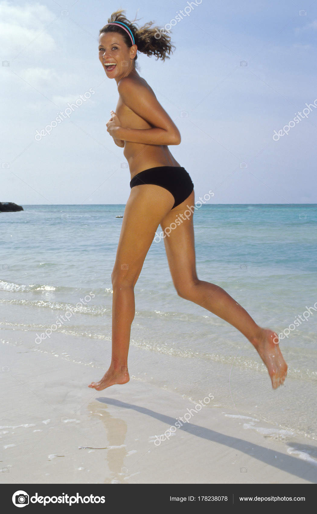 half naked woman on beach Gargantuan football cock