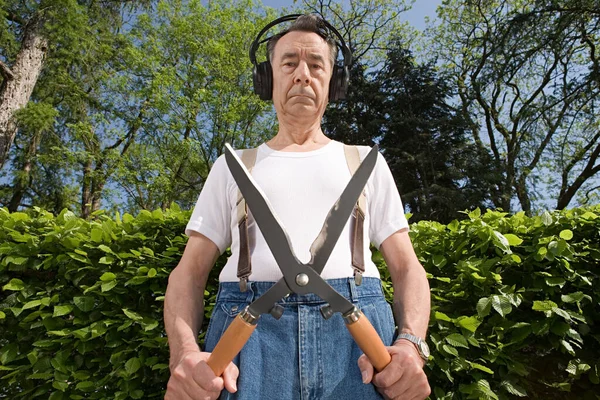 Man Wearing Headphones Holding Gardening Shears — Stock Photo, Image