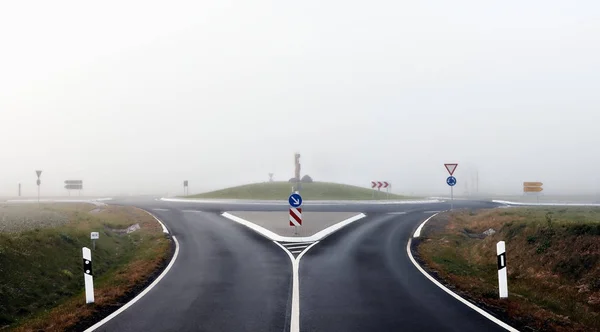 Roundabout Road Signs Mist — Stock Photo, Image