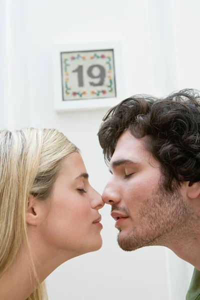 Couple Touching Noses Home — Stock Photo, Image