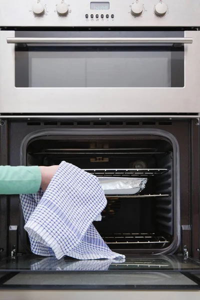 Person Putting Dish Oven — Stock Photo, Image
