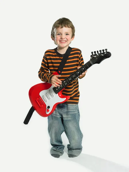 Menino Com Brinquedo Guitarra Elétrica — Fotografia de Stock