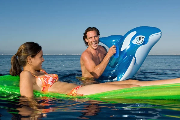 Couple Sea Inflatables Royalty Free Stock Photos