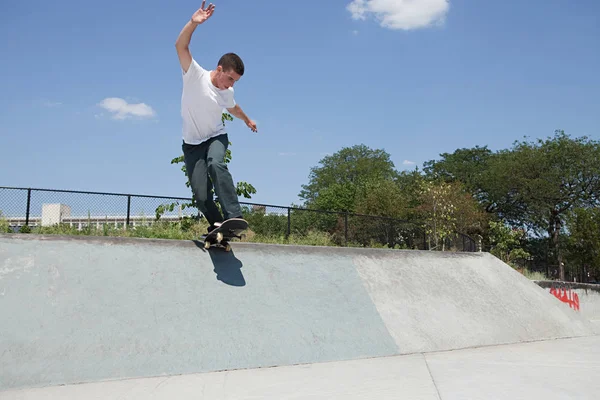 Boy Skateboard Jumping Ramp Stock Image