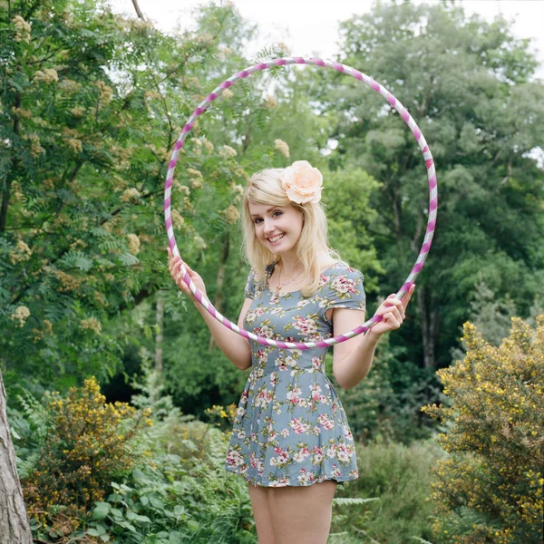 Woman holding plastic hoop