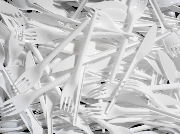 白いプラスチック刃物の背景 — ストック写真