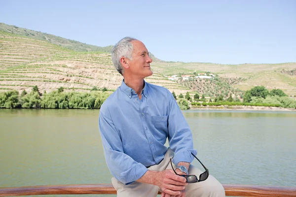 Senior man on a boat holiday