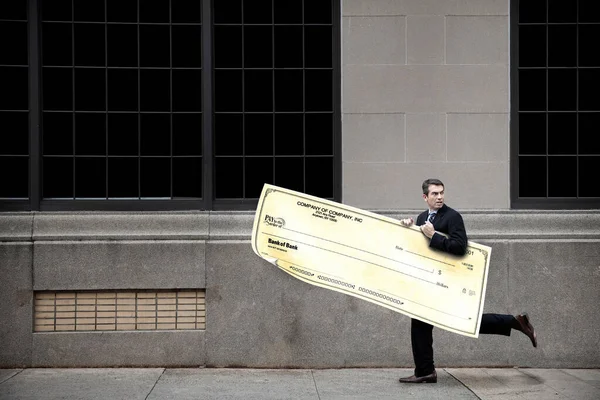 Businessman Running Sidewalk Oversized Cheque — Stock Photo, Image