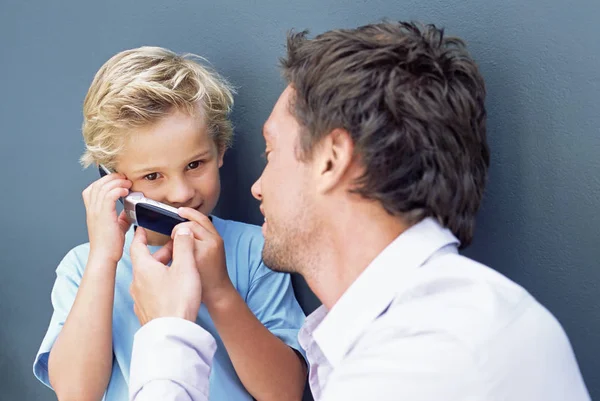 Father Letting Son Use Mobile Phone — Stock Photo, Image