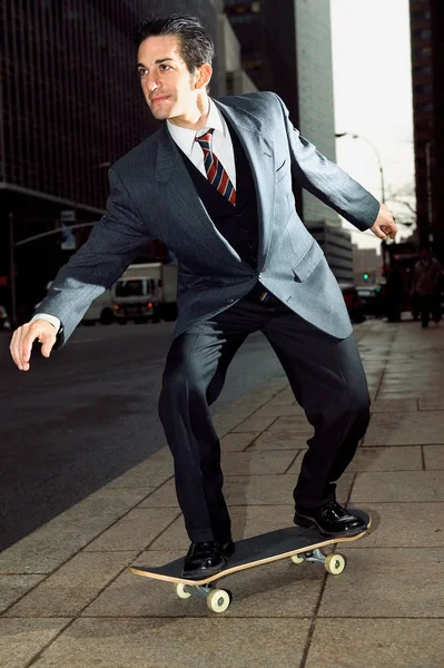 Businessman Riding Skateboard — Stock Photo, Image