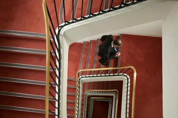 Businessman Walking Spiral Stairway — Stock Photo, Image