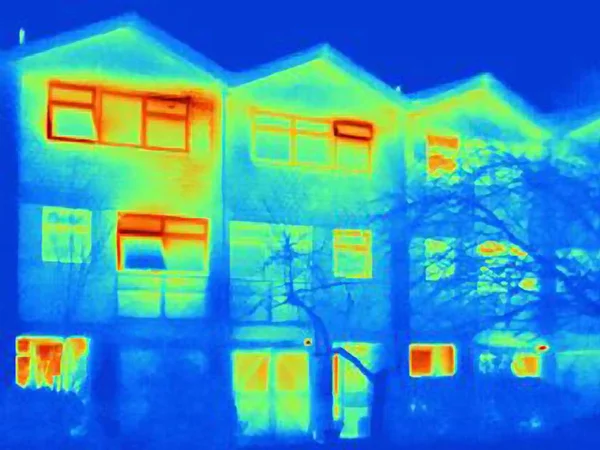 Thermal image of house, showing loss of heat from open windows