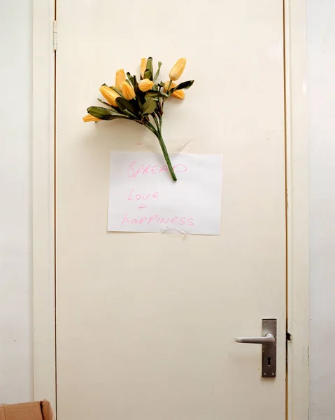 Bunch of flowers on door — Foto de Stock