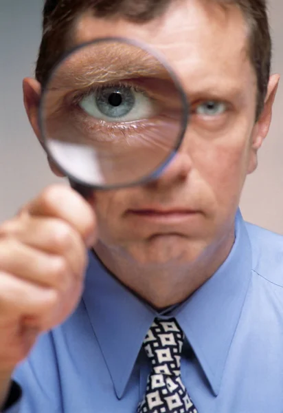 Man Holding Magnifying Glass — Stock Photo, Image