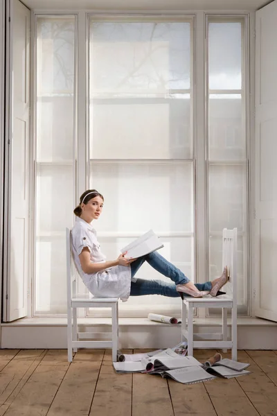 Woman with magazines at home