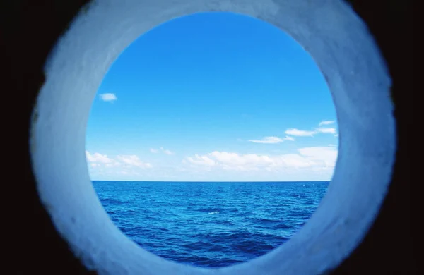 Sea through a porthole — Stock Photo, Image