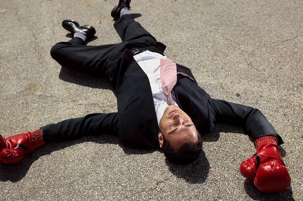 close-up portrait of Businessman unconscious on floor