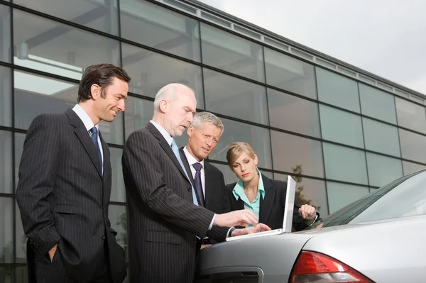 Businesspeople Looking Laptop Automobile Boot — Stock Photo, Image