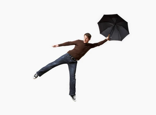 Man Blåst Bort Med Paraply — Stockfoto