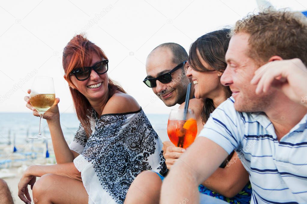 Friends drinking together outdoors