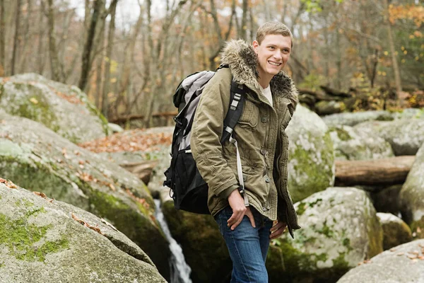 Young Man Amongst Stones — Stock Photo, Image