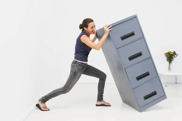 Woman Struggles Filing Cabinet — Stock Photo, Image