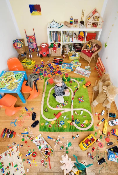 Boy Plays Room Crowded Toys — Stock Photo, Image