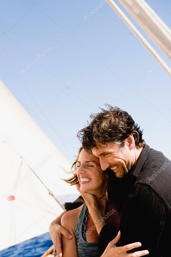 couple embracing each other on a boat