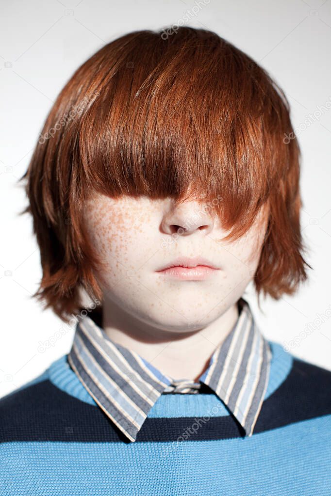 Boy with hair covering his eyes