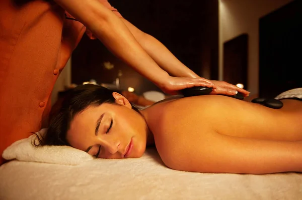 Woman Receiving Hot Stone Massage — Stock Photo, Image