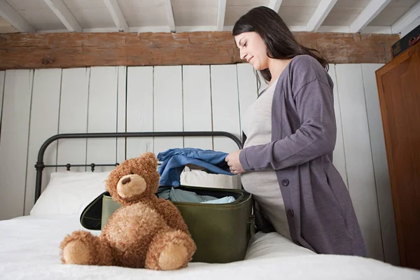 Expectant Mother Packing Suitcase — Stock Photo, Image