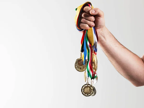 Mature Man Holding Gold Medals White Background – stockfoto