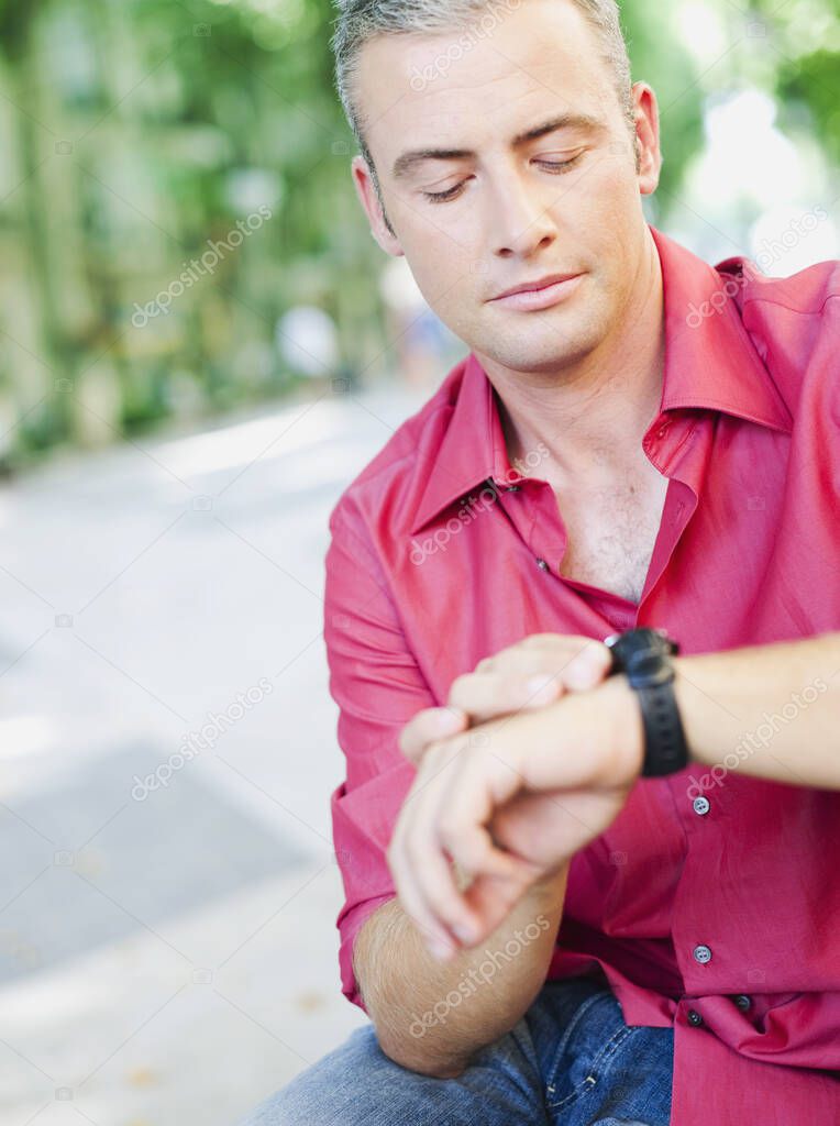 man looking at his watch