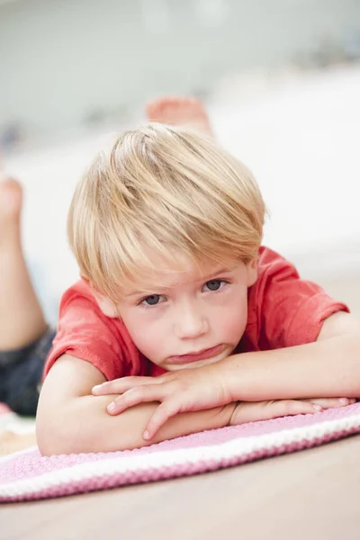 Young Boy Lying Prone Floor — Stock Photo, Image