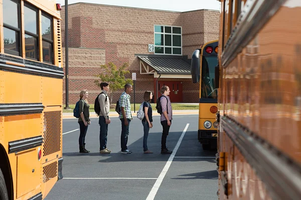 Teacher and pupils crossing road Stock Photo - Alamy