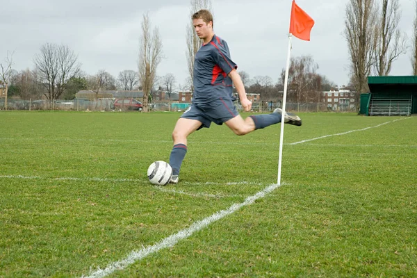 Footballer taking a corner kick