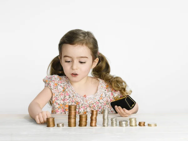 Girl Stacking Coins Counter — 스톡 사진