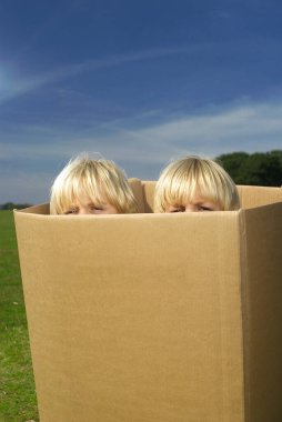 boys looking out of box clipart