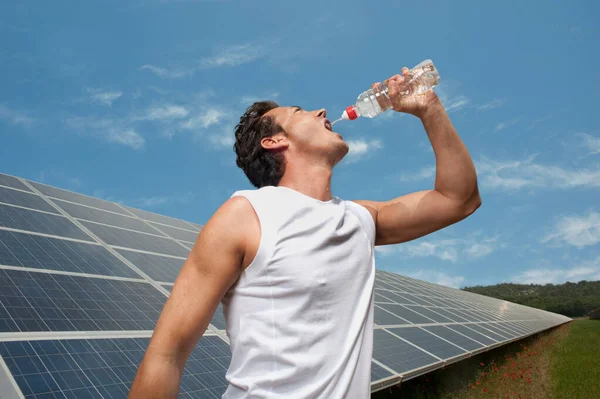 Man Drinking Front Solar Panel — Stock Photo, Image