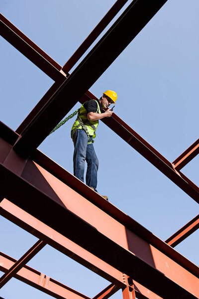 Steel worker over blue sky 