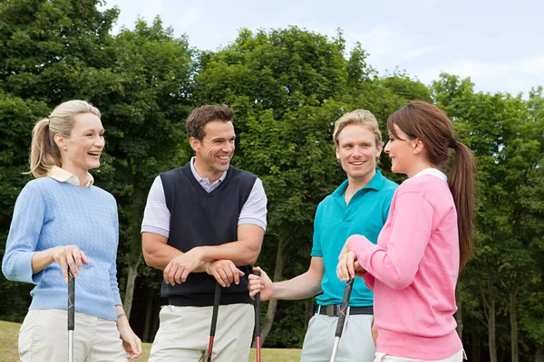 group portrait of happy Four golfing friends