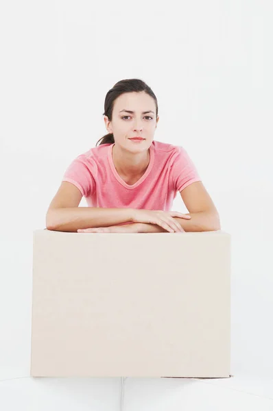 Woman at home with storage box