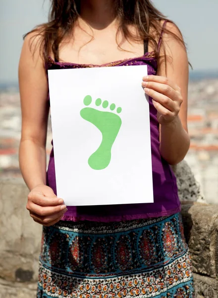 Woman Holding Paper Green Foot — Stock Photo, Image