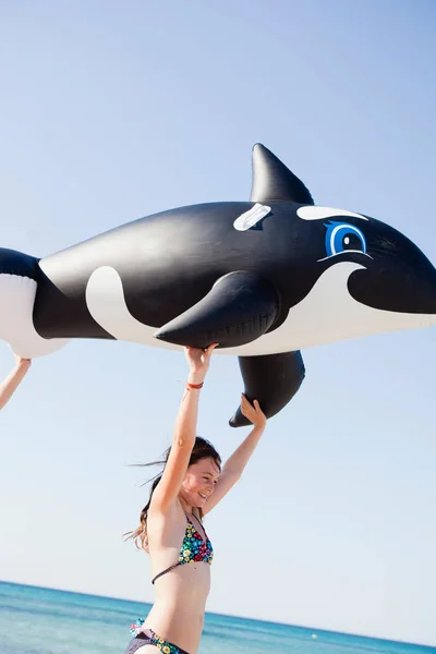 Young Girl Carrying Toy Whale — Stock Photo, Image