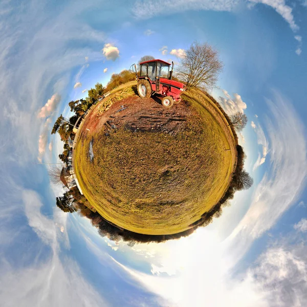 Tractor in field with little planet effect — 스톡 사진