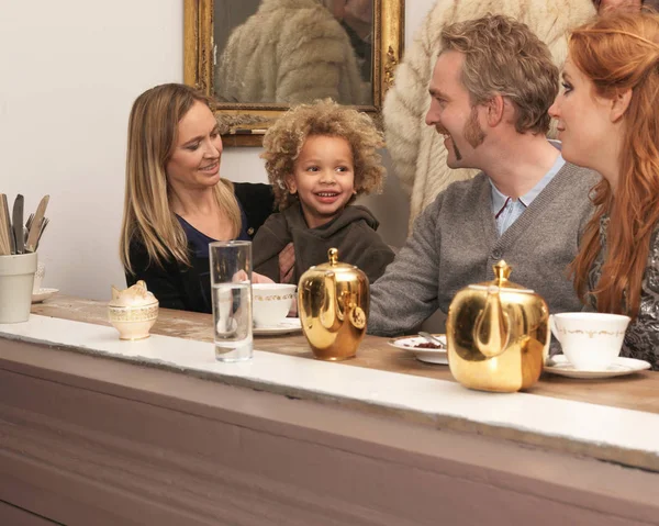 family having tea in caf