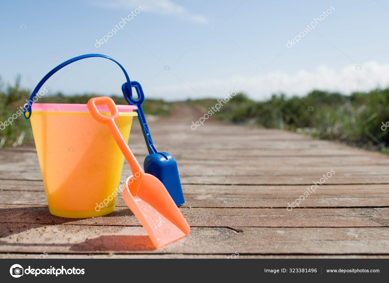 Bucket Spades Blue Sky Stock Photo by ©ImageSource 323381496